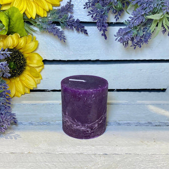 Rustic amethyst pillar candle by Grand Illusions, 70x75mm, with textured surface and natural stone appearance.