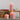 Dusky pink rustic pillar candle by Grand Illusions, 70x130mm, showcasing textured wax finish and natural candle style.