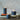 Rustic Inky Blue Pillar Candle by Grand Illusions, 70x75mm, showing a textured blue wax surface and a wick at the top.