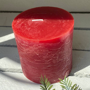 Rustic Lipstick Red Pillar Candle by Grand Illusions, 100x100mm, showing its textured surface and warm, vibrant color.