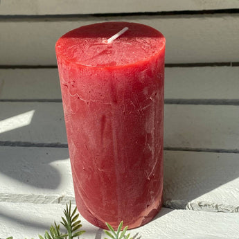 Rustic red pillar candle from Grand Illusions, Lipstick Red, 70x130mm, with textured surface and classic cylindrical shape.