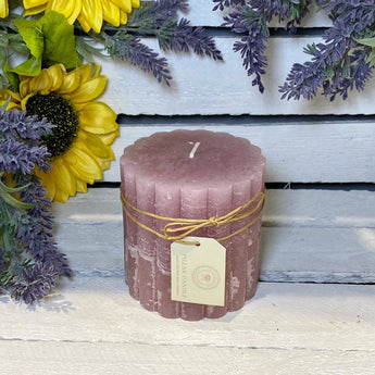 Rustic scalloped dusky pink pillar candle by Grand Illusions, 100x100mm, with textured surface and elegant design.