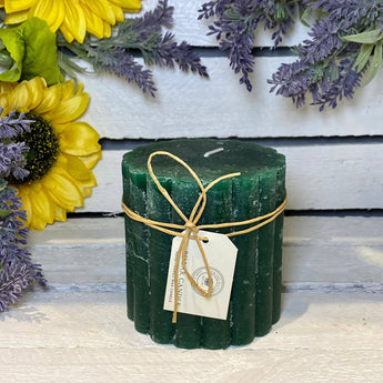 Emerald green rustic scalloped pillar candle, 100x100mm, by Grand Illusions, with textured, decorative design for cozy ambiance.
