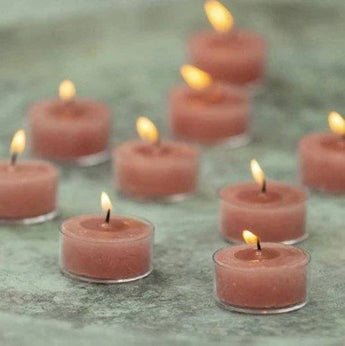 Rustic tealight candle in petrol blue color from Grand Illusions, shown as a single tealight candle for decorative lighting.