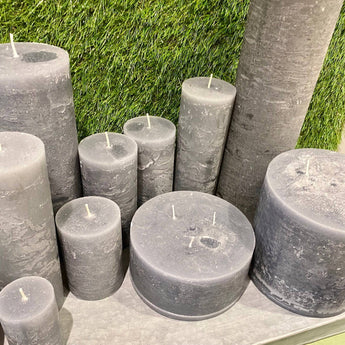 Rustic stone pillar candle by Chic Antique, 90-hour burn time, showcasing a textured, natural finish perfect for cozy decor.