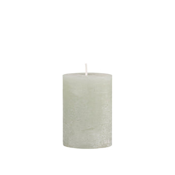 Rustic beige Verte Pillar Candle by Chic Antique, 40-hour burn time, displayed on a wooden surface with a warm glow.