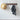 Vintage-style coat rack with multiple hooks, made by Grand Illusions, featuring a classic design and wood finish.