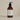 Plum & Ashby Wild Fig & Saffron Hand and Body Wash with fresh fig and saffron scent in a clear bottle.