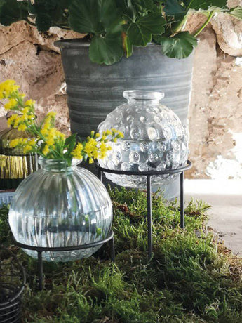 Wire stand for Jive bottles by Casa Verde, featuring a sturdy metal frame to hold bottles securely and display them attractively.